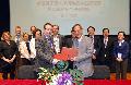 Mr Wong (right) and Professor Argyle exchange the signed text of the MOU on veterinary education co-operation.