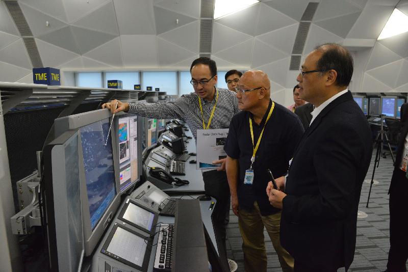 Legislative Council Members (from right) Dr Lam Tai-fai and Mr Albert Chan, visit the new Air Traffic Control Centre of the Civil Aviation Department (CAD) today (July 12) and are briefed by representatives of the CAD on the progress of the implementation of the new Air Traffic Management System.