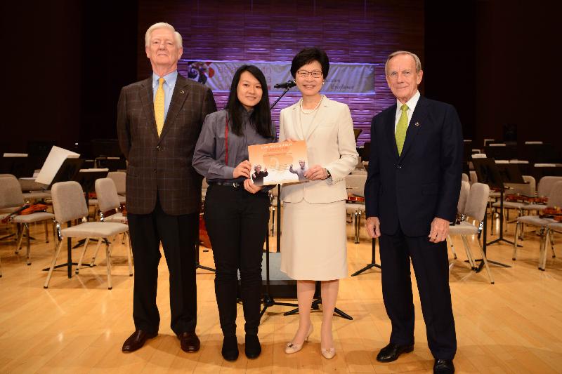 The Chief Secretary for Administration, Mrs Carrie Lam, attended the 26th Asian Youth Orchestra (AYO) Summer Festival opening ceremony at the Hong Kong Academy for Performing Arts today (July 18). Photo shows Mrs Lam (second right) presenting a scholarship certificate to an AYO representative. Also present are  the Founder, Artistic Director and Conductor of the AYO, Mr Richard Pontzious (first left); and the AYO Board Chairman, Mr James Thompson (first right).