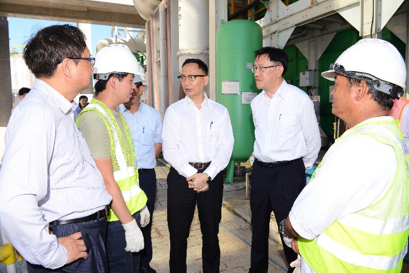 While visiting the Stonecutters Island Sewage Treatment Works today (July 22), the Secretary for the Civil Service, Mr Clement Cheung (third right), is briefed by staff on how the de-odourising facilities minimise nuisance to the surroundings.