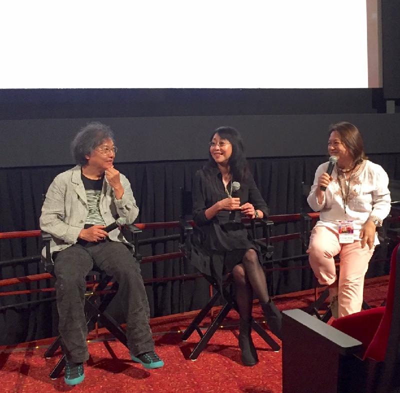 導演編劇組合張婉婷（中）及羅啟銳（左）七月二十三日（紐約時間）出席《三城記》的映後交流會。《三城記》是今屆亞洲美國國際電影節主打電影。