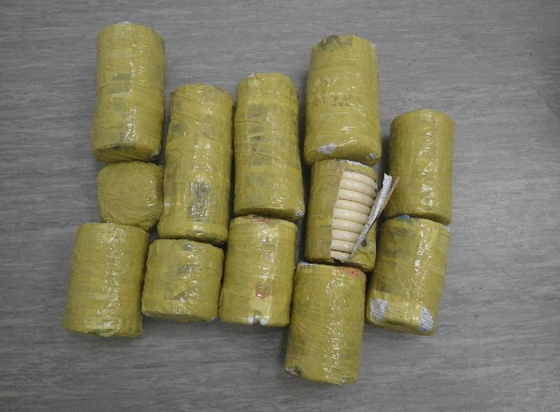 Hong Kong Customs seized about 8 kilograms of suspected worked ivory and arrested an incoming male passenger at Hong Kong International Airport today (July 27). The suspected worked ivory seized was wrapped with newspaper and adhesive tape.