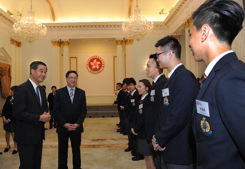 The Chief Executive, Mr C Y Leung, accompanied by the Commissioner of Police, Mr Lo Wai-chung, meets the fight crime ambassadors today (August 11).
