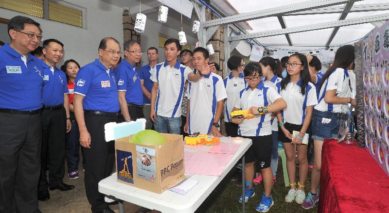 The officiating guests visit the crime prevention booths produced by JPC members.

 
