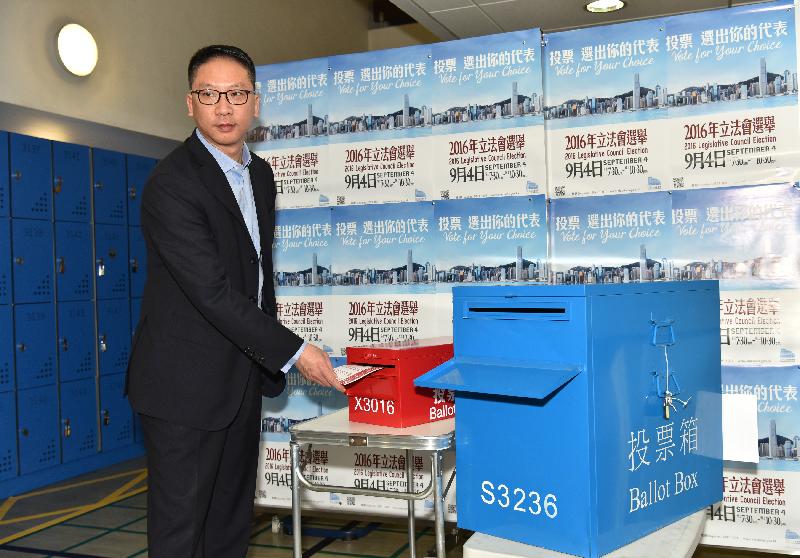 The Secretary for Justice, Mr Rimsky Yuen, SC, casts his votes in the 2016 Legislative Council General Election at the German Swiss International School Peak Campus today (September 4). Picture shows Mr Yuen casting his vote for the functional constituency in the 2016 Legislative Council General Election.