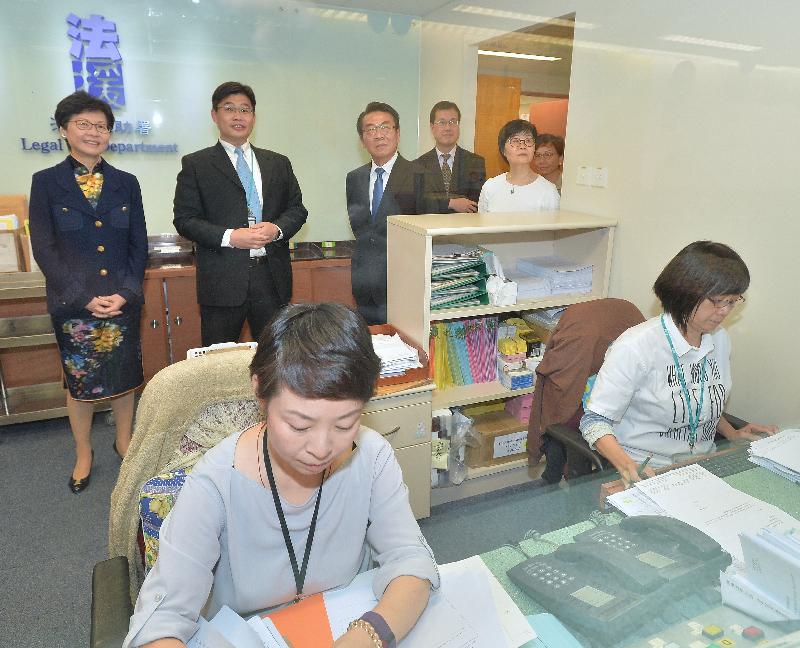The Chief Secretary for Administration, Mrs Carrie Lam (back row, first left), today (September 7) visited the Legal Aid Department. Photo shows Mrs Lam touring the Application and Processing Division. Accompanying her are the Director of Legal Aid, Mr Thomas Kwong (back row, third left); the Deputy Director of Legal Aid (Application and Processing), Mr Chris Chong (back row, third right); the Deputy Director of Legal Aid (Policy and Administration), Ms Alice Chung (back row, first right); and the Assistant Director of Legal Aid (Application and Processing), Ms Mo Yuk-wah (back row, second right).