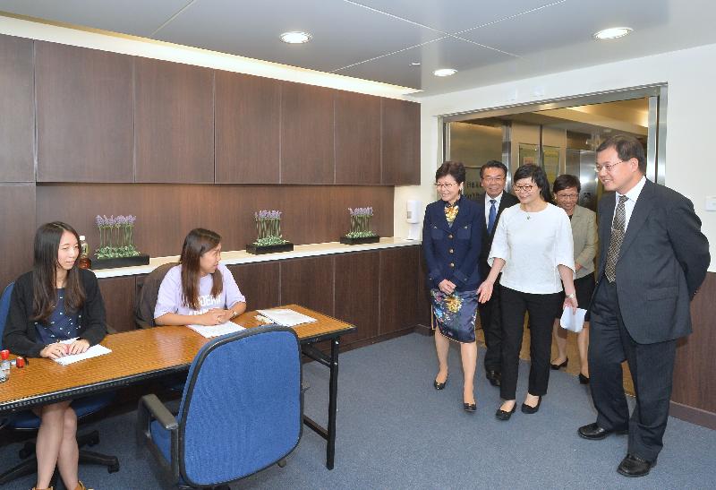 The Chief Secretary for Administration, Mrs Carrie Lam (third left), visits the Legal Aid Department today (September 7) to learn more about the work of the department and meet with its staff. Accompanying her are the Director of Legal Aid, Mr Thomas Kwong (fourth left); the Deputy Director of Legal Aid (Application and Processing), Mr Chris Chong (first right); the Deputy Director of Legal Aid (Policy and Administration), Ms Alice Chung (second right); and the Assistant Director of Legal Aid (Application and Processing), Ms Mo Yuk-wah (third right).