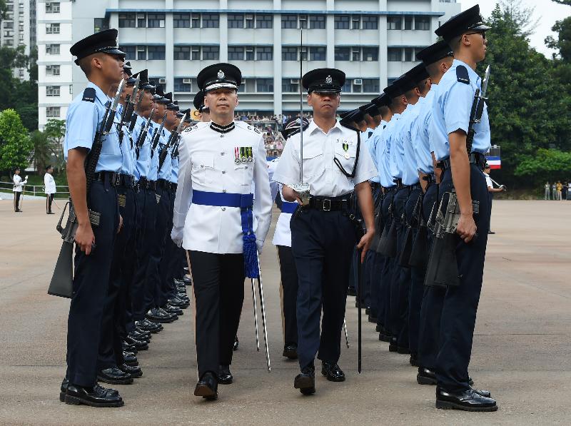 The Deputy Commissioner of Police (Operations), Mr Wong Chi-hung, reviews 35 probationary inspectors and 222 recruit constables.
