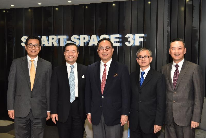 The Secretary for Innovation and Technology, Mr Nicholas W Yang (centre), is pictured with the Chairman of the Board of Directors of Hong Kong Cyberport Management Company Limited, Dr George Lam (second left); the Under Secretary for Innovation and Technology, Dr David Chung (second right); the Government Chief Information Officer, Mr Allen Yeung (first left); and the Chief Executive Officer of Hong Kong Cyberport Management Company Limited, Mr Herman Lam (first right), at the Smart-Space during his visit to Cyberport today (October 19).
