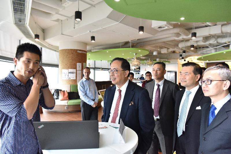 The Secretary for Innovation and Technology, Mr Nicholas W Yang (second left), views the demonstration of a smart ring equipped with a voice assistant by a co-founder of Cyberport incubatee Origami Lab (first left) and congratulates the start-up for winning the Asia leg of Elevator World Tour during his visit to Cyberport today (October 19). Looking on are the Chairman of the Board of Directors of Hong Kong Cyberport Management Company Limited, Dr George Lam (second right); the Under Secretary for Innovation and Technology, Dr David Chung (first right); and the Chief Executive Officer of Hong Kong Cyberport Management Company Limited, Mr Herman Lam (third right).