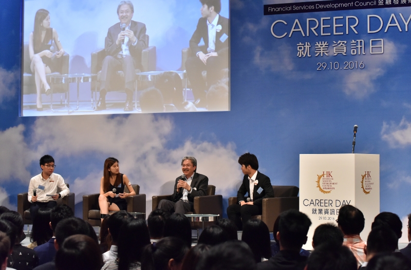 The Financial Secretary, Mr John C Tsang (second right), chats with students attending the Career Day event held by the Financial Services Development Council today (October 29).