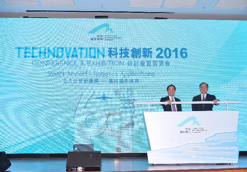 The Secretary for Innovation and Technology, Mr Nicholas W Yang (right), and the Chief Executive Officer of the Airport Authority Hong Kong, Mr Fred Lam (left), launch the Hong Kong International Airport Technovation Conference and Exhibition today (November 2). The theme of the Conference and Exhibition is "Smart Airport - Robotics Applications".