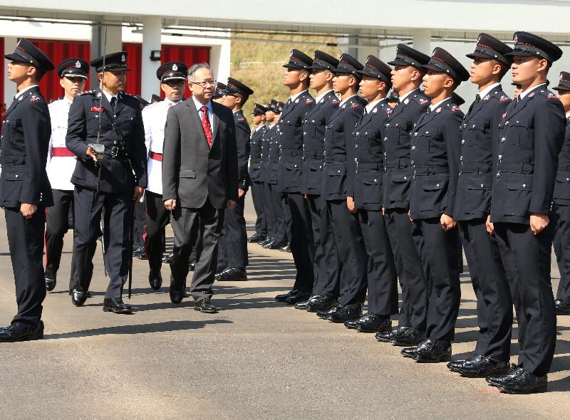 The Secretary for Security, Mr Lai Tung-kwok (fifth left), reviews the 176th Fire Services passing-out parade at the Fire and Ambulance Services Academy today (November 4).