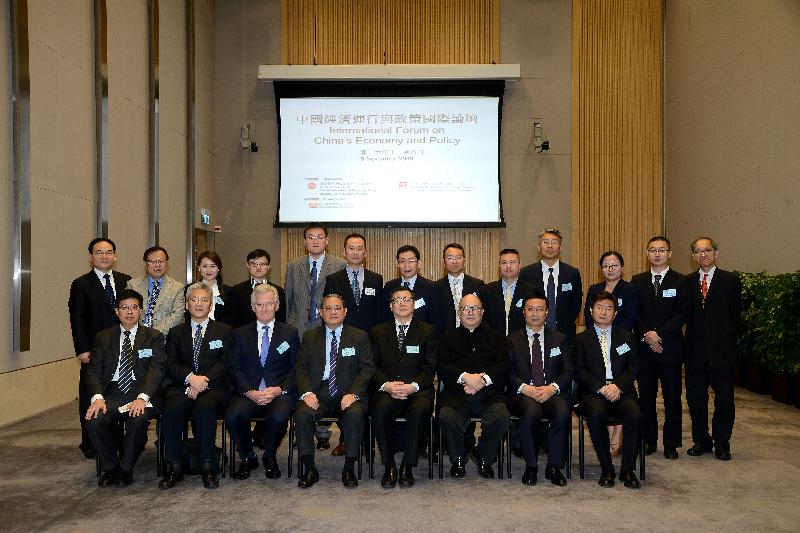 The Central Policy Unit and the National Academy of Economic Strategy of the Chinese Academy of Social Sciences jointly held the International Forum on China's Economy and Policy at Central Government Offices, Tamar, today (November 8). Picture shows (front row, from left) the Managing Director of Fung Business Intelligence, Mr Chang Ka-mun; the Director of the Taiwan, Hong Kong and Macao Affairs Office of the Chinese Academy of Social Sciences, Mr Wang Lei; the Member of the Board of Directors and Chief Officer, Government, Investor and Public Relations of Home Credit BV, Mr Mel Carvill; the Chairman of the Fung Group, Dr Victor Fung; the President of the Chinese Academy of Social Sciences, Professor Wang Weiguang; the Head of the Central Policy Unit, Mr Shiu Sin-por; the Director of the National Academy of Economic Strategy of the Chinese Academy of Social Sciences, Professor Gao Peiyong; and the Director of the National Institute of International Strategy of the Chinese Academy of Social Sciences, Professor Li Xiangyang, with speakers and guests.
