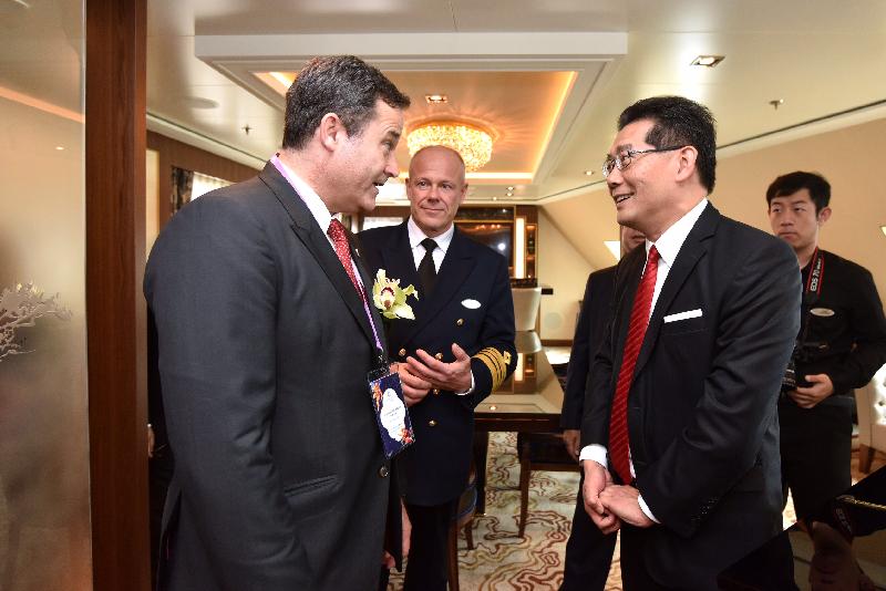 The Secretary for Commerce and Economic Development, Mr Gregory So (right), is briefed by the President of Dream Cruises, Mr Thatcher Brown (left), on the facilities of the Genting Dream at the Kai Tak Cruise Terminal today (November 12).