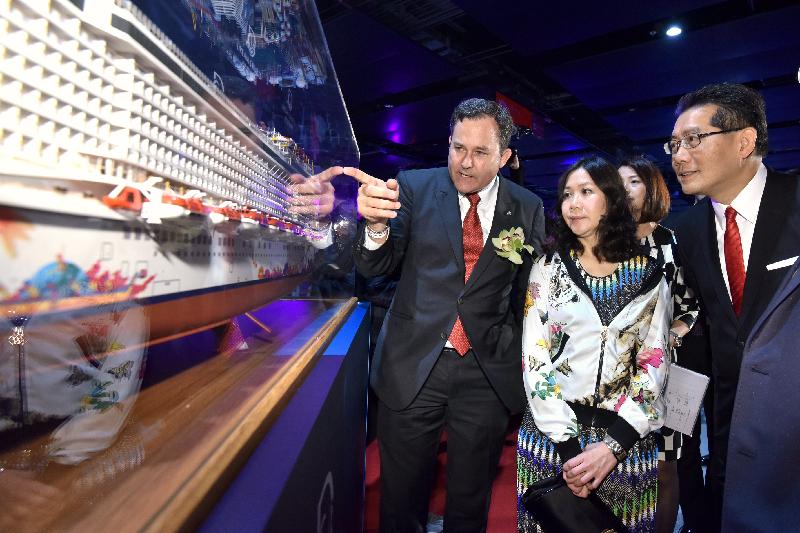 Accompanied by the President of Dream Cruises, Mr Thatcher Brown (left), the Secretary for Commerce and Economic Development, Mr Gregory So (right), and the Commissioner for Tourism, Miss Cathy Chu (centre), tour the Genting Dream at the Kai Tak Cruise Terminal today (November 12). 
