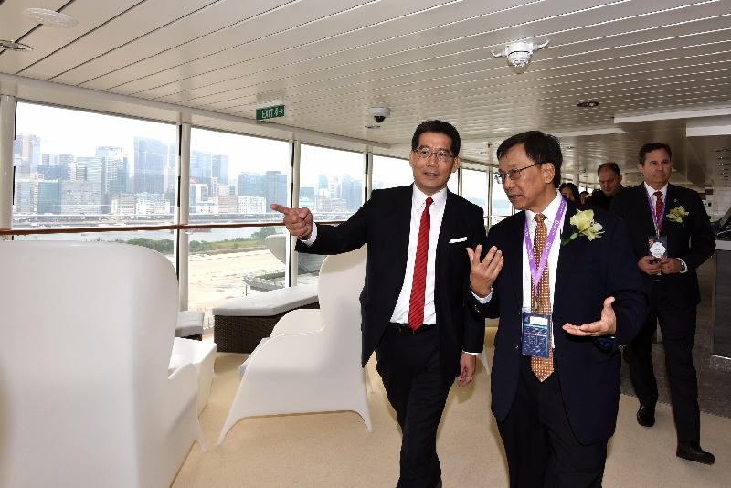 Accompanied by the Chairman and Chief Executive Officer of Genting Hong Kong Limited, Tan Sri Lim Kok Thay (right), the Secretary for Commerce and Economic Development, Mr Gregory So (left), tours the Genting Dream at the Kai Tak Cruise Terminal today (November 12). 