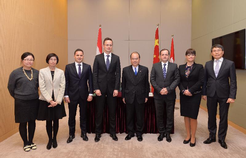 The Secretary for Labour and Welfare, Mr Matthew Cheung Kin-chung (fourth right), met with the Minister of Foreign Affairs and Trade of Hungary, Mr Péter Szijjártó (fourth left), at the Central Government Offices, Tamar, today (December 1) to announce the establishment of a bilateral Working Holiday Scheme between Hong Kong and Hungary. Also attending the ceremony were the Permanent Secretary for Labour and Welfare, Miss Annie Tam (second left); the Commissioner for Labour, Mr Carlson Chan (first right); the Assistant Commissioner for Labour (Policy Support), Ms Queenie Wong (first left); the Consul-General of Hungary in Hong Kong, Dr Pál Kertész (third left); the Ministerial Commissioner, Ministry of Foreign Affairs and Trade of Hungary, Mr Gyula Budai (third right), and the Director General, China Department of the Ministry of Foreign Affairs and Trade of Hungary, Ms Márta Tóth-Mészáros (second right).