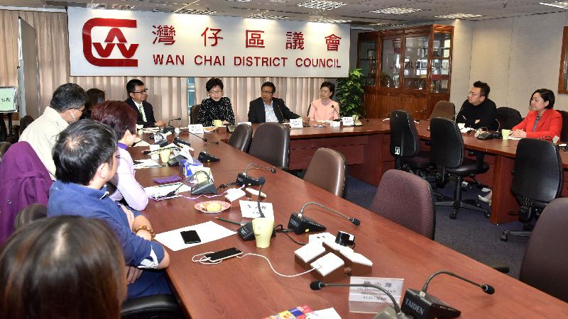 The Chief Secretary for Administration, Mrs Carrie Lam (fifth right), visits Wan Chai District today (December 1) and meets with members of the Wan Chai District Council (WCDC) to listen to their views on district affairs. Also joining the meeting are the Chairman of the WCDC, Mr Stephen Ng (fourth right); the Vice Chairman of the WCDC, Dr Jennifer Chow (third right); and the District Officer (Wan Chai), Mr Rick Chan (sixth right).