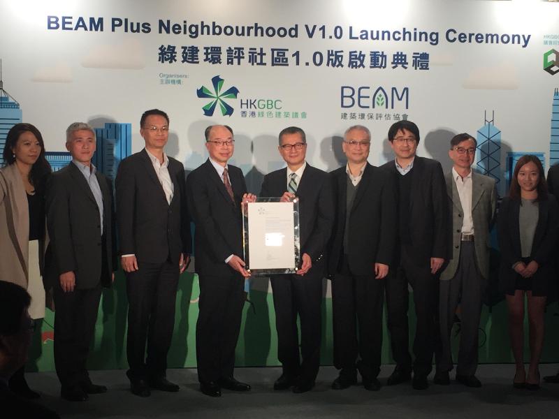 The BEAM Plus Neighbourhood Version 1.0 Assessment Tool Launch Ceremony was held at the Hong Kong Maritime Museum, Central, today (December 6). The transformation of the Electrical and Mechanical Services Department's Headquarters into a green building was awarded the Platinum certificate of the BEAM Plus Neighbourhood Pilot Version. Picture shows the Director of Electrical and Mechanical Services, Mr Frank Chan (fourth left), receiving the certificate on behalf of the Electrical and Mechanical Services Department from the Secretary for Development, Mr Paul Chan (centre).