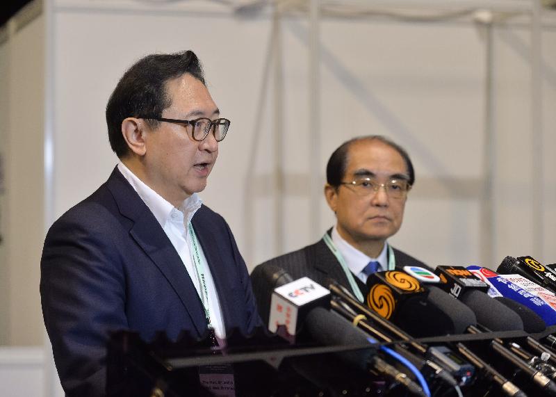 The Chairman of the Electoral Affairs Commission (EAC), Mr Justice Barnabas Fung Wah (left), meets the media today (December 12) at the media centre at AsiaWorld-Expo to conclude the 2016 Election Committee Subsector Ordinary Elections after the announcement of all election results. Also present is EAC member Mr Arthur Luk, SC (right).