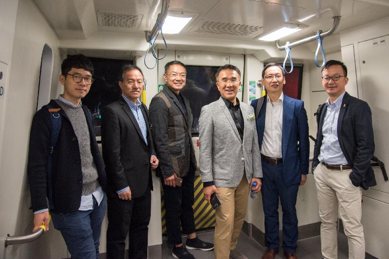 Legislative Council members (from left) Mr Nathan Law, Dr Fernando Cheung, Mr Paul Tse, Mr Michael Tien, Mr Wilson Or and Mr Chan Chi-chuen pictured today (December 12) on a train on the MTR South Island Line (East).

