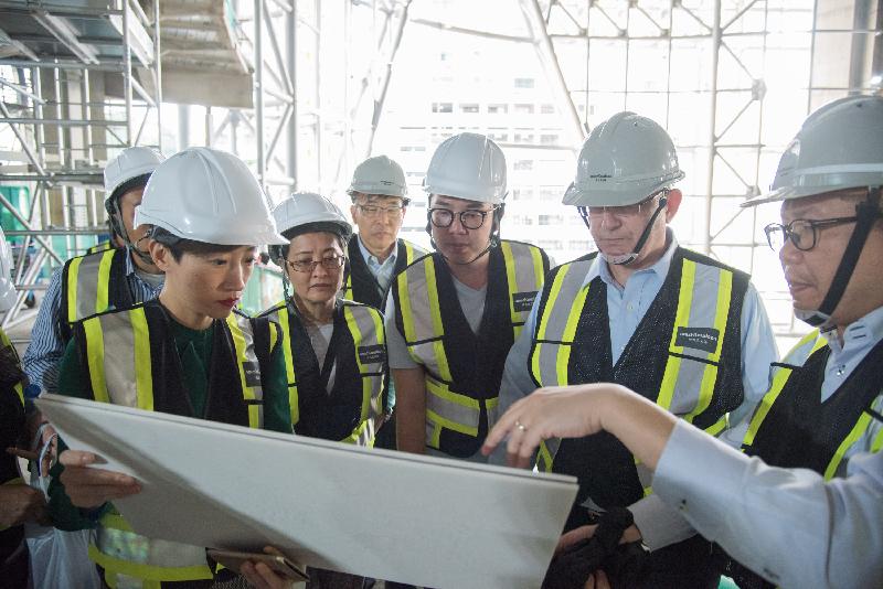 Members of the Legislative Council visit the construction site of the Xiqu Centre in the West Kowloon Cultural District today (December 12) to learn about the construction progress of the project.