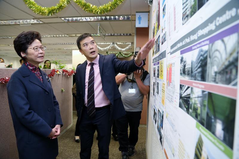 The Chief Secretary for Administration, Mrs Carrie Lam (left), visited the Housing Department today (December 15) and went to the Regional Management Office (Tai Po, North and Shatin) under the Estate Management Division. Photo shows staff of the office briefing Mrs Lam their daily work.
