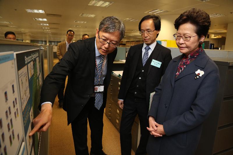 The Chief Secretary for Administration, Mrs Carrie Lam (first right), today (December 15) visited the Housing Department. Photo shows Mrs Lam being briefed on the work of the Structural Engineering Section of the Development and Construction Division. Accompanying her was the Assistant Director of Housing (Project), Mr Lawrence Chung (second right).
