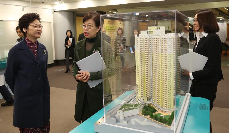 The Chief Secretary for Administration, Mrs Carrie Lam (first left), visited the Housing Department today (December 15). Photo shows Mrs Lam being briefed by the Assistant Director of Housing (Housing Subsidies), Mrs Rosa Ho (second left) on the work relating to applications and sales for the subsidised home ownership schemes. 
