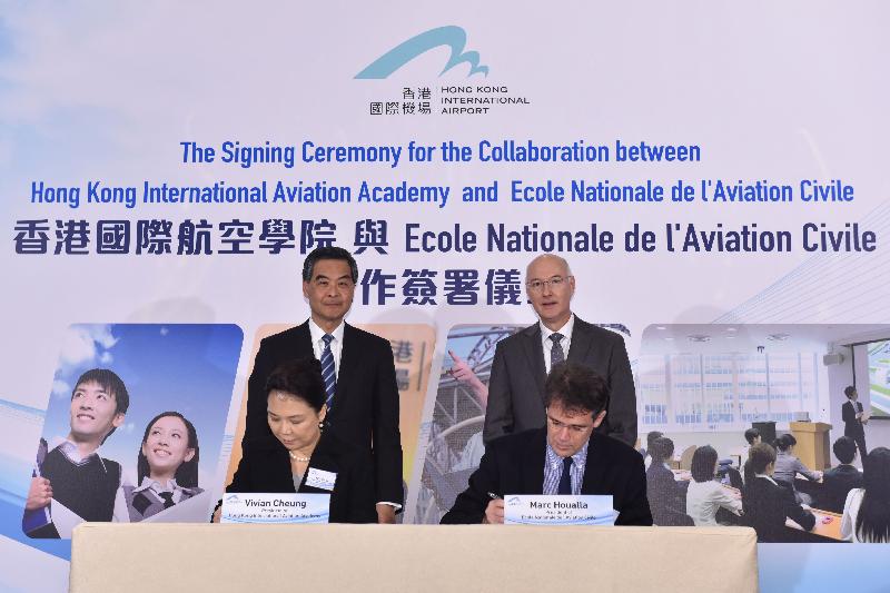 The Chief Executive, Mr C Y Leung, attended the Signing Ceremony for the Collaboration between Hong Kong International Aviation Academy (HKIAA) and Ecole Nationale de l'Aviation Civile (ENAC) this afternoon (December 16). Photo shows Mr Leung (back row, left) and the Consul General of France in Hong Kong and Macau, Mr Eric Berti (back row, right), witnessing the signing of a memorandum of understanding on co-operation by the President of the HKIAA, Mrs Vivian Cheung (front row, left), and the President of ENAC, Mr Marc Houalla (front row, right).