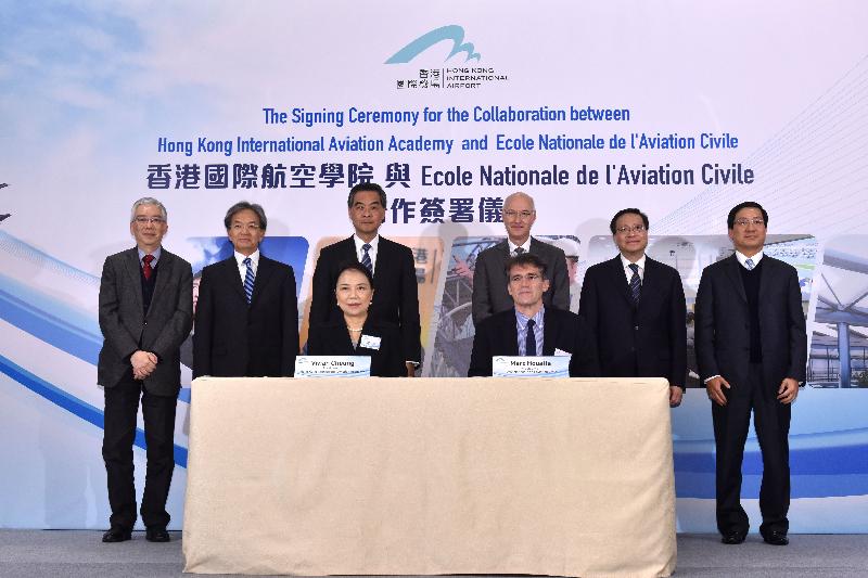 The Chief Executive, Mr C Y Leung, attended the Signing Ceremony for the Collaboration between Hong Kong International Aviation Academy (HKIAA) and Ecole Nationale de l'Aviation Civile (ENAC) this afternoon (December 16). Photo shows Mr Leung (back row, third left) with the Secretary for Transport and Housing, Professor Anthony Cheung Bing-leung (back row, second right); the Permanent Secretary for Transport and Housing (Transport), Mr Joseph Lai (back row, first left); the Consul General of France in Hong Kong and Macau, Mr Eric Berti (back row, third right); the Chairman of the Airport Authority Hong Kong (AA), Mr Jack So (back row, second left); the Chief Executive Officer of the AA, Mr Fred Lam (back row, first right); the President of the HKIAA, Mrs Vivian Cheung (front row, left); and the President of ENAC, Mr Marc Houalla (front row, right), at the signing ceremony.