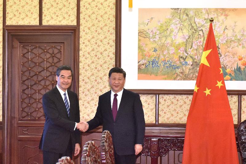 The Chief Executive, Mr C Y Leung, briefed President Xi Jinping in Beijing this afternoon (December 23) on the latest economic, social and political developments in Hong Kong. Picture shows Mr Leung (left) and President Xi (right) shaking hands before the meeting.