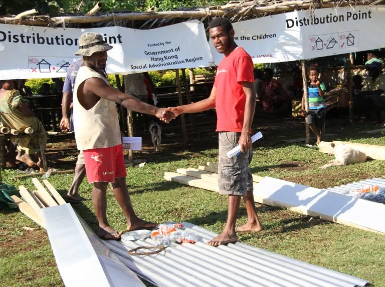 Local staff of the relief organisation distribute emergency shelter repair tools and materials to cyclone victims in Vanuatu, to enable the victims to repair their damaged houses for use as temporary shelters.