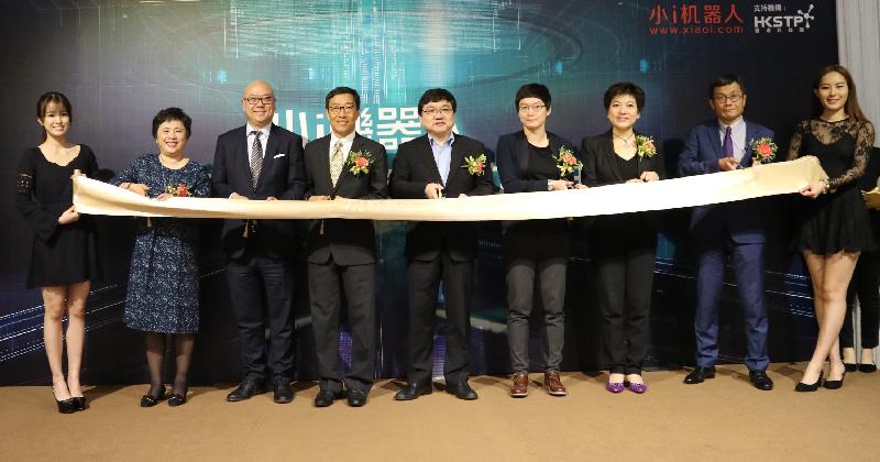 From second left: the Senior Vice President of Shanghai Xiaoi Robot Technology Co Ltd, Ms Xu Yiya; Associate Director-General of Investment Promotion Mr Charles Ng; the Chief Executive Officer of the Hong Kong Science and Technology Parks Corporation, Mr Albert Wong; the President and Chief Technology Officer of Xiaoi, Mr Zhu Pinpin; the Manager of Electronics Cluster of the Hong Kong Science and Technology Parks Corporation, Dr Crystal Fok; the Vice Chairlady of the Hong Kong Call Centre Association, Ms Joyce Poon; and the Regional Director of Xiaoi, Mr Scott Shih, officiate at the ribbon cutting ceremony at the opening of Xiaoi's subsidiary in Hong Kong today (January 9).