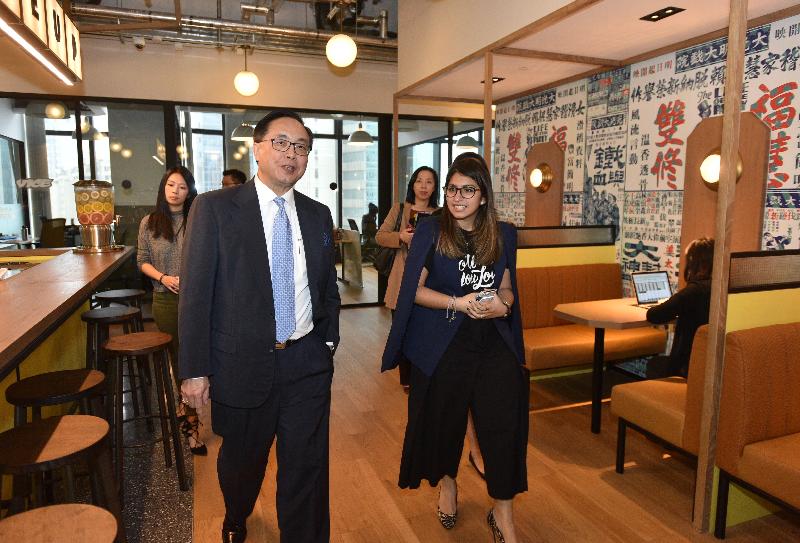 The Secretary for Innovation and Technology, Mr Nicholas W Yang (front left), tours WeWork Tower 535 this afternoon (January 13) to better understand the business model of WeWork in Hong Kong.