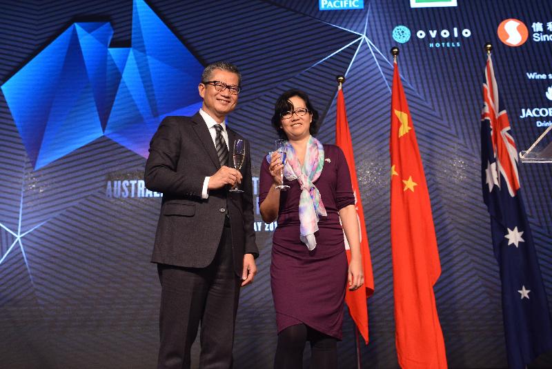 The Financial Secretary, Mr Paul Chan (left), proposes a toast at the Australia Day Reception held by the Australian Consulate-General Hong Kong this evening (January 24). Next to Mr Chan is the Acting Australian Consul-General, Ms Janaline Oh. 