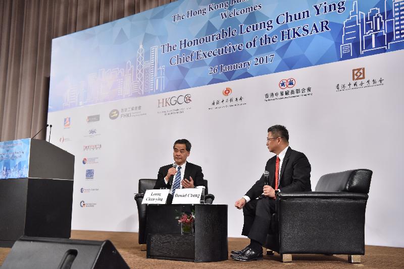 The Chief Executive, Mr C Y Leung, attended the Joint Business Community Luncheon 2017 at the Hong Kong Convention and Exhibition Centre today (January 26). Photo shows Mr Leung (left) exchanging views with representatives of the business sector during the question-and-answer session.