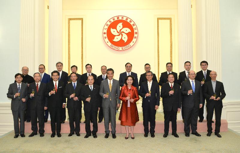 The Chief Executive, Mr C Y Leung, and Mrs Leung (front row, sixth and seventh left) and senior government officials propose a toast today (February 8) at the Spring Reception at Government House.