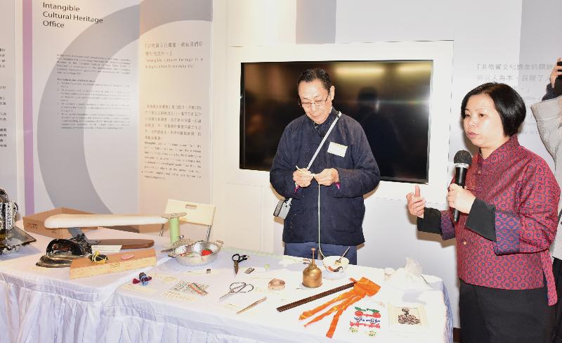 The Head of the Intangible Cultural Heritage Office, Ms Cissy Ho (right), explains the sewing techniques demonstrated by the Master of the sewing techniques of Hong Kong-style Cheongsam, Mr Simon Fung (left) at the press briefing on the recommended items to be inscribed on Representative List of the Intangible Cultural Heritage of Hong Kong today (February 12).
