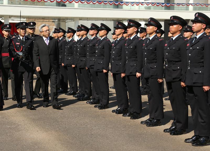 The Permanent Secretary for Security, Mr Joshua Law (fourth left), reviews the 177th Fire Services passing-out parade at the Fire and Ambulance Services Academy today (February 17).
