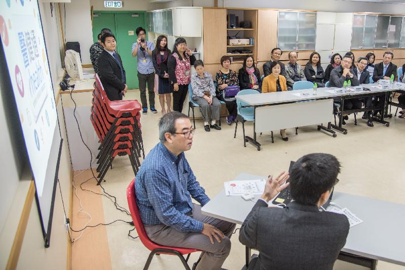 The Legislative Council Panel on Health Services conducted a visit to the Caritas Harold H W Lee Care and Attention Home today (February 21). Photo shows LegCo Members being briefed on the operation of the Electronic Health Record Sharing System by government representatives.