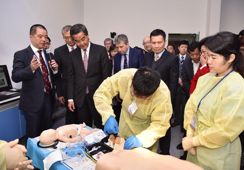 The Chief Executive, Mr C Y Leung, visited the University of Hong Kong - Shenzhen Hospital (HKU-SZ Hospital) in Shenzhen today (February 23). Picture shows Mr Leung (third left) visiting the Clinical Skills Simulation Training Center with the Hospital Chief Executive of HKU-SZ Hospital, Professor Lo Chung-mau (second left).
