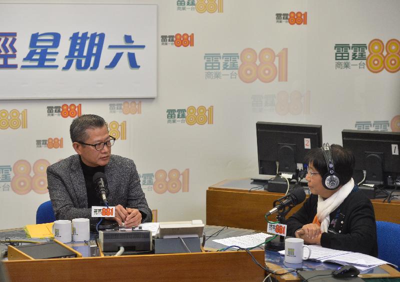 The Financial Secretary, Mr Paul Chan (left), attends Commercial Radio's programme "Saturday Forum" this morning (February 25) to answer questions on the 2017-18 Budget.