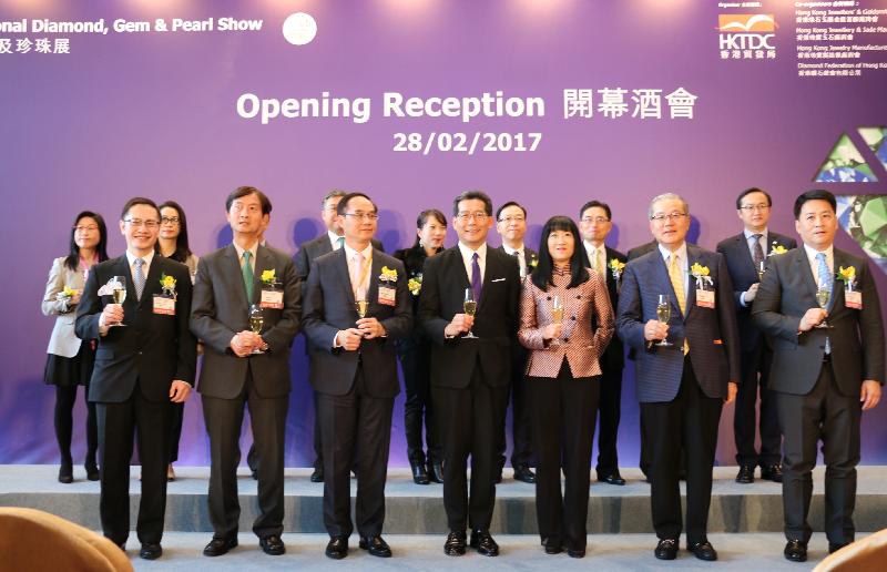 The Secretary for Commerce and Economic Development, Mr Gregory So (front row, centre); the Chairman of the Hong Kong Trade Development Council (HKTDC) Jewellery Advisory Committee, Mr Kent Wong (front row, third left); the Chairman of the Hong Kong International Diamond, Gem & Pearl Show and the Hong Kong International Jewellery Show organising committees, Mr Lawrence Ma (front row, second right; the Executive Director of the HKTDC, Ms Margaret Fong (front row, third right), and other officiating guests pictured today (February 28) at the opening reception for the Hong Kong International Diamond, Gem & Pearl Show. Addressing the opening reception, Mr So said that Hong Kong's total export value of precious jewellery, pearls, gem stones and semi-precious stones was about US$27 billion last year, underlining Hong Kong's position as the world's premier jewellery trading and production hub. 
