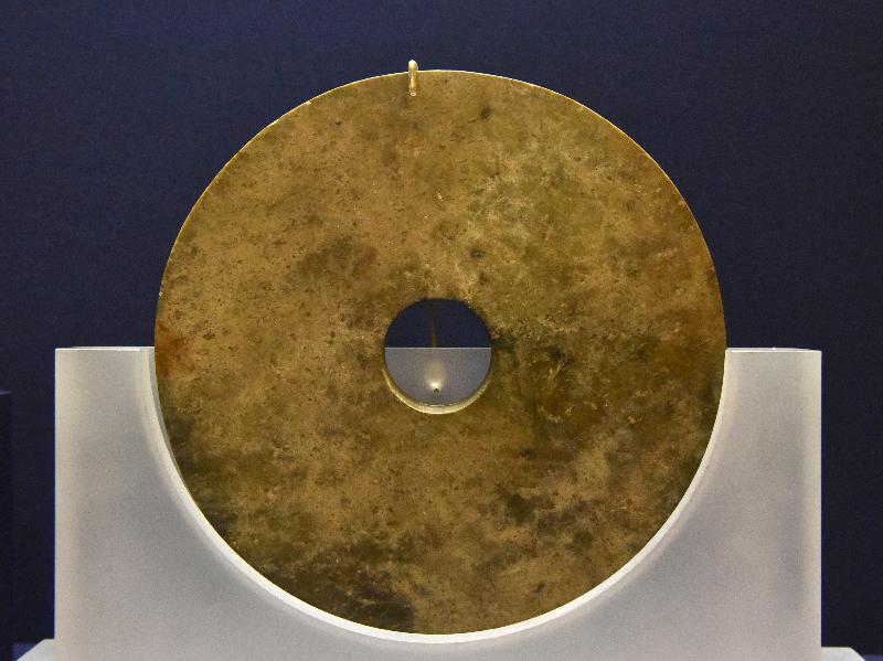 The opening ceremony of the exhibition entitled "The Legacy of Liangzhu Culture: Neolithic Relics from the Zhejiang Provincial Museum" was held at the Flagstaff House Museum of Tea Ware today (March 2). The exhibition is jointly organised by the Hong Kong Museum of Art and the Zhejiang Provincial Museum. Photo shows one of the exhibits, jade bi disc excavated from the Liangzhu site.