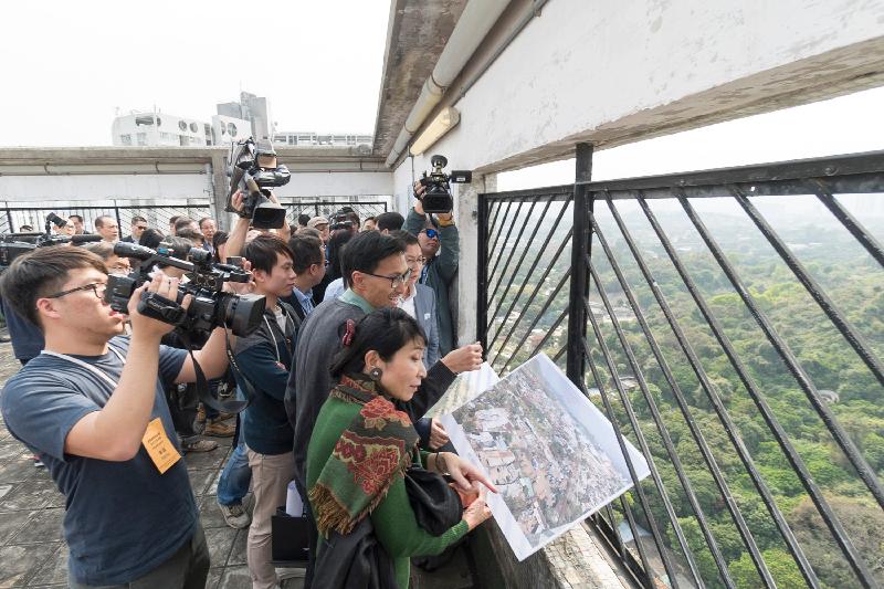 Legislative Council Panel on Development visited Yuen Long today (March 3). Photo shows Members of the Legislative Council overlooking the current condition of the sites for the public housing development plan in Wang Chau at the rooftop of Kam Ping House in Long Ping Estate, Yuen Long.