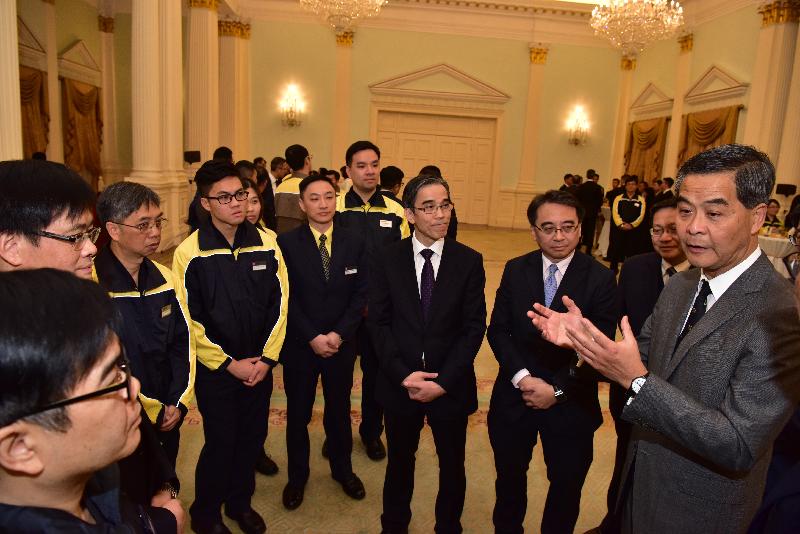 The Chief Executive, Mr C Y Leung, met with the staff involved in the rescue operation of the arson case in an MTR train compartment, which took place on February 10, at Government House this afternoon (March 8) to commend the professionalism they displayed during the incident. Photo shows Mr Leung (right) listening to the debriefing by the MTR staff on how they tackled the fire and evacuated the passengers that day.