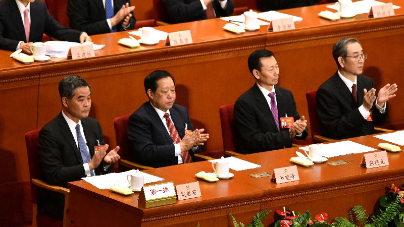 The Chief Executive, Mr C Y Leung (first left), attends the closing meeting for the fifth session of the 12th Chinese People's Political Consultative Conference National Committee in Beijing this morning (March 13).