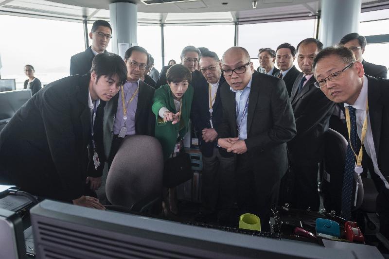 Members of the Legislative Council visit the Air Traffic Control Tower of the Civil Aviation Department to learn more about the aerodrome traffic control operation today (March 15).